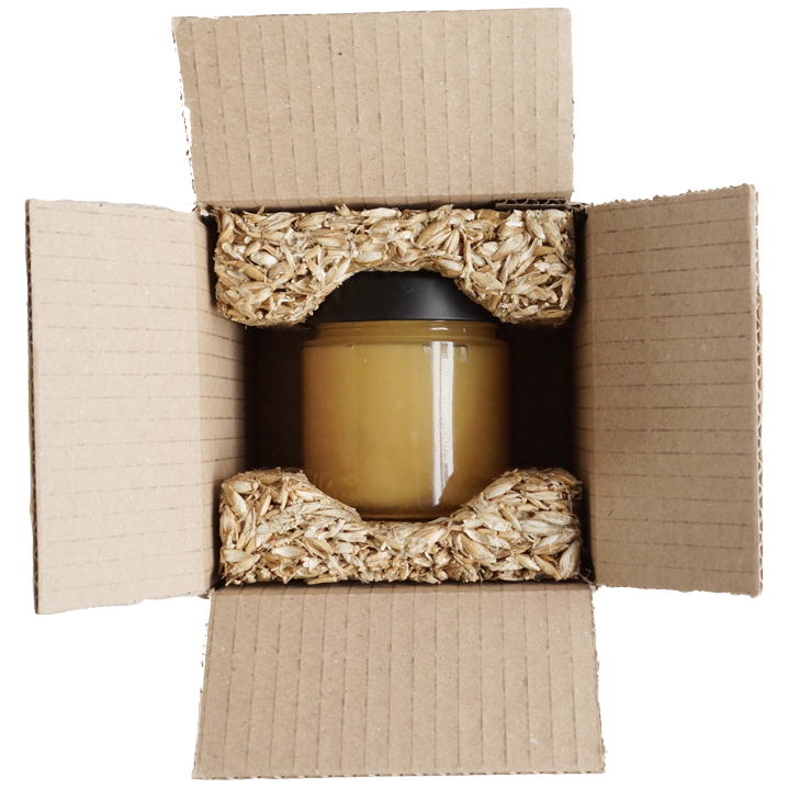 Honigglas in Schutzverpackung aus Getreidespelzen