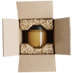 Honigglas in Schutzverpackung aus Getreidespelzen