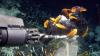 Der Tauchroboter MARUM-Quest sammelt Muscheln, die Cycloclasticus-Symbiosebakterien enthalten, und ölreiche Asphalte an einem Gasaustritt in 3000 Metern Meerestiefe ein.